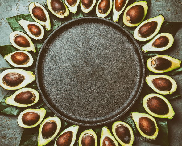 Food Background with Avocado and Avocado Tree Leaves. Copy Space - Stock Photo - Images