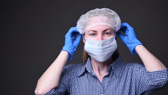  A Girl in a Medical Mask Protects Herself From the Covid-19 Virus. Epidemic in China and Around the alt