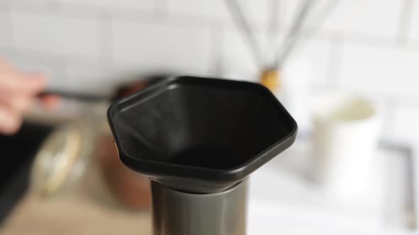 Barista Makes Aeropress Step By Step. Put Coffee Into Device. alt
