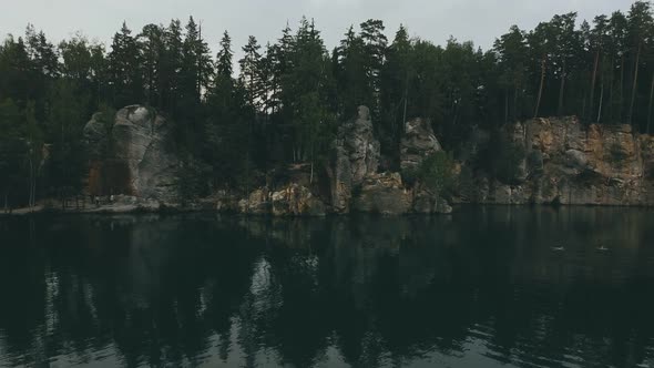 Adršpach-Teplice Rocks national park filmed from drone. Green forest with rocks and blue lake