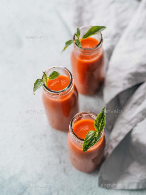 Gaspacho soup in glass bottles, vertical