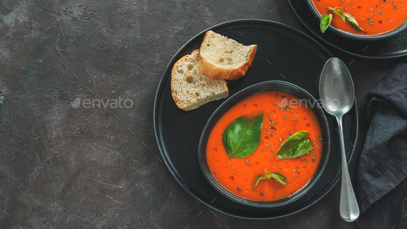 Gaspacho soup on black, top view, copy space
