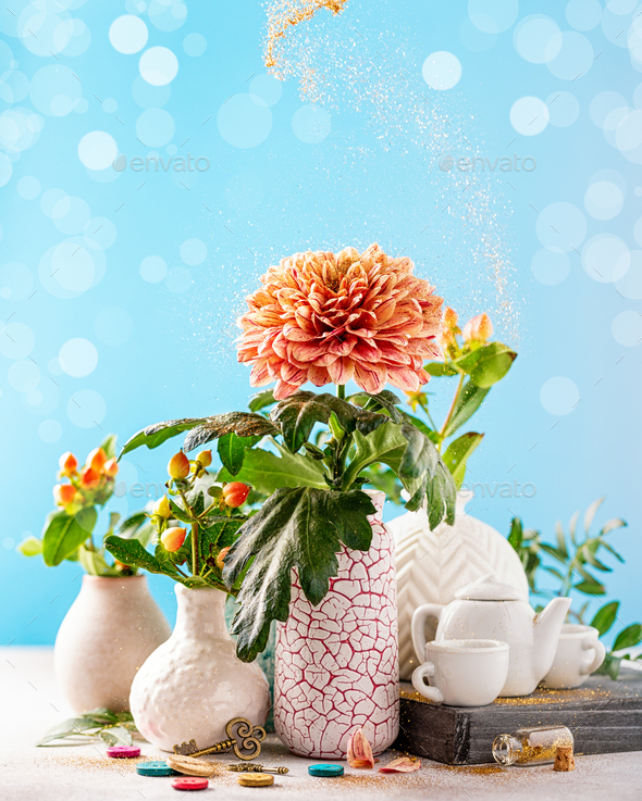 Vase with beautiful chrysanthemum flowers on light table
