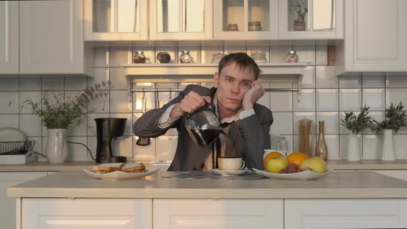 Exhausted Man Pouring Coffee Early in the Morning alt