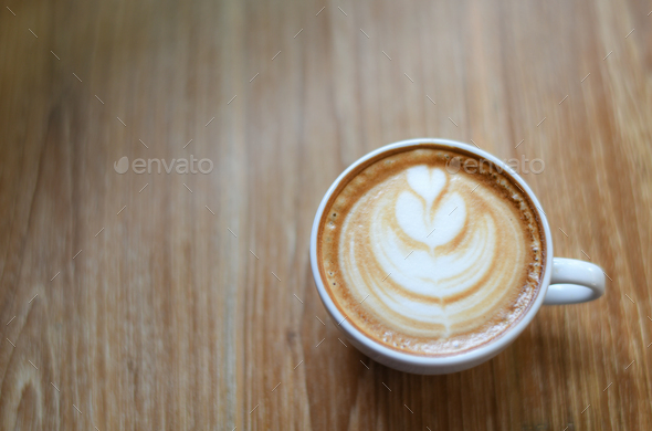 Glass Of White Latte Coffee On Beautiful Wooden Floors Top With Leaf Pattern Stock Photo By Poungsaed Eco