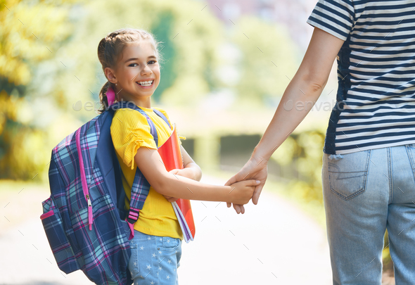 Parent and pupil go to school - Stock Photo - Images