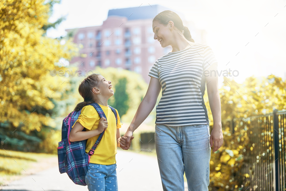 Parent and pupil go to school - Stock Photo - Images