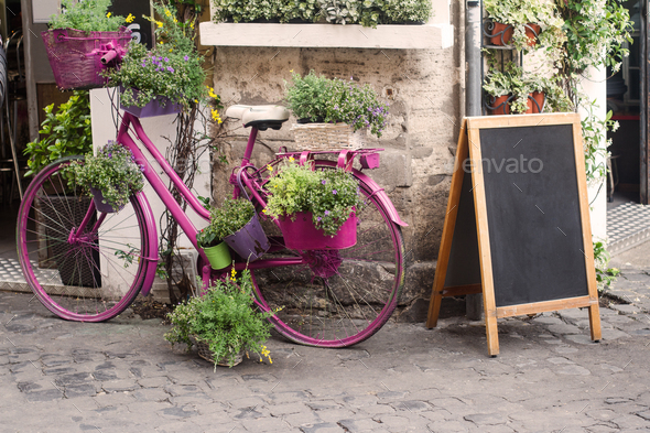 bistro store front with pink bicycle and chalk board
