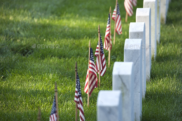 American flags in front of tombstones at Arlington National Cemetery for Memorial Day