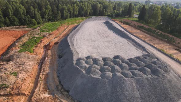 Aerial View of a Large Mountain of Stockpiled Granite Rubble alt