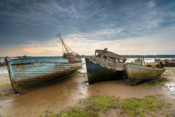 Old abandoned fishing boats on the River Orwell Stock Photo by flotsom