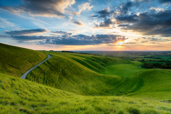 Dramatic sunset sky over The Manger at Uffington - Stock Photo - Images