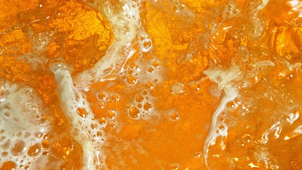 Super Slow Motion Shot of Rippling Fresh Beer Wave From Top Shot at 1000Fps alt