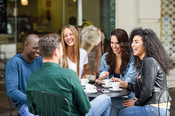 Multiracial group of five friends having a coffee together Stock Photo ...