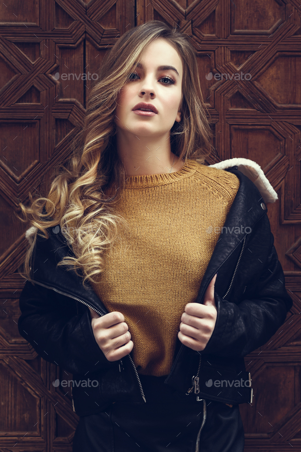 Beautiful blonde russian woman in urban background - Stock Photo - Images
