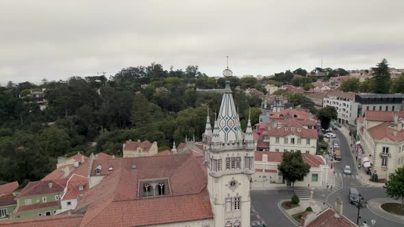 Sintra Town Hall building, tower decorated with colourful Portuguese tiles. Aerial orbiting shot. alt
