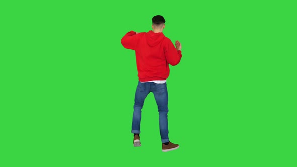 Young Man Dancing Hip-hop Doing Waves on a Green Screen, Chroma Key alt