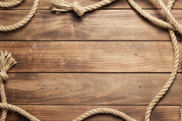 ship rope at wooden board background Stock Photo by 