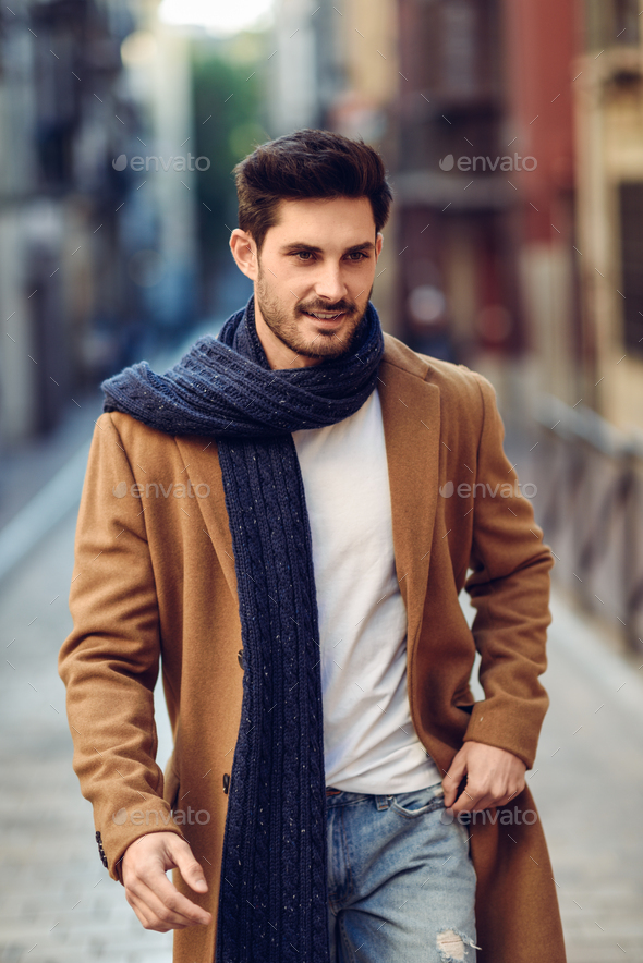 Young man wearing winter clothes in the street. Stock Photo by javi_indy