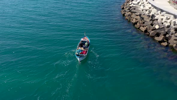 Aerial view of a fishing boat floating in sea