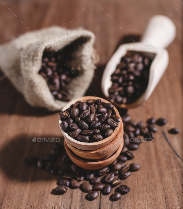 coffee beans coffee bag and wooden scoop