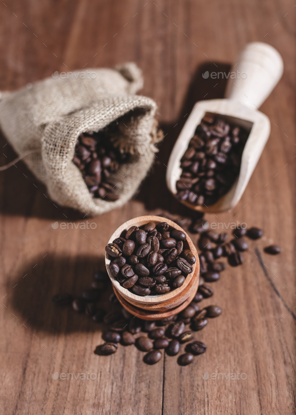 coffee beans coffee bag and wooden scoop