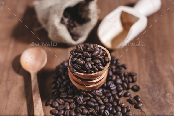 coffee beans on wood saucer