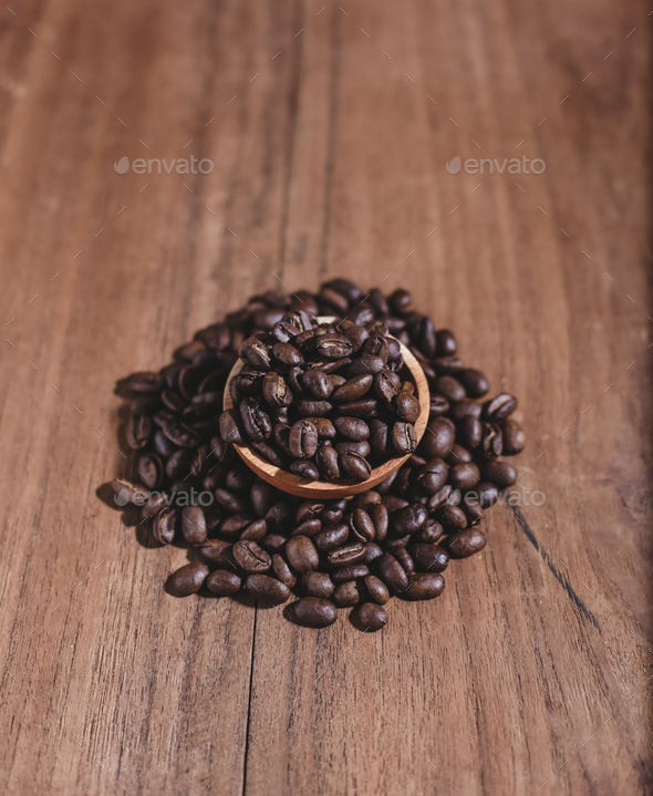 coffee beans on wood saucer