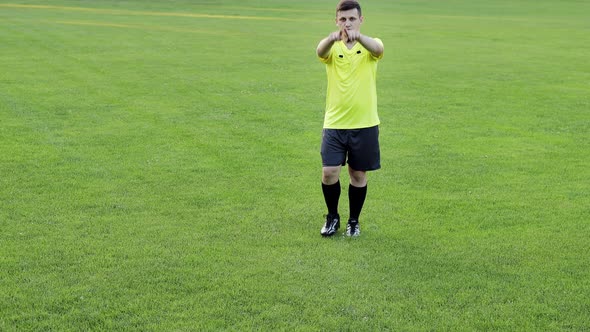 Referee goes watching VAR or violation of the rules and shows a penalty, yellow or red card alt