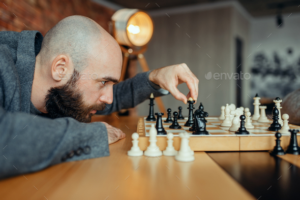 Chess player playing black figures, queen move