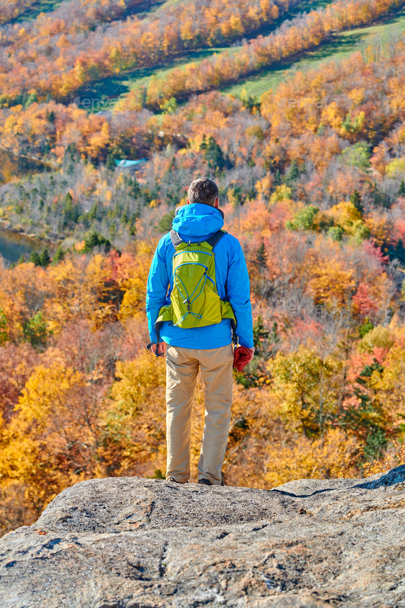 Backpacker man at Artist's Bluff in autumn - Stock Photo - Images
