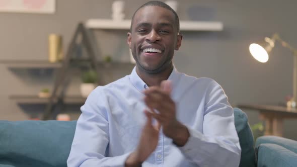 Portrait Shot of Happy African Man Clapping Applauding alt