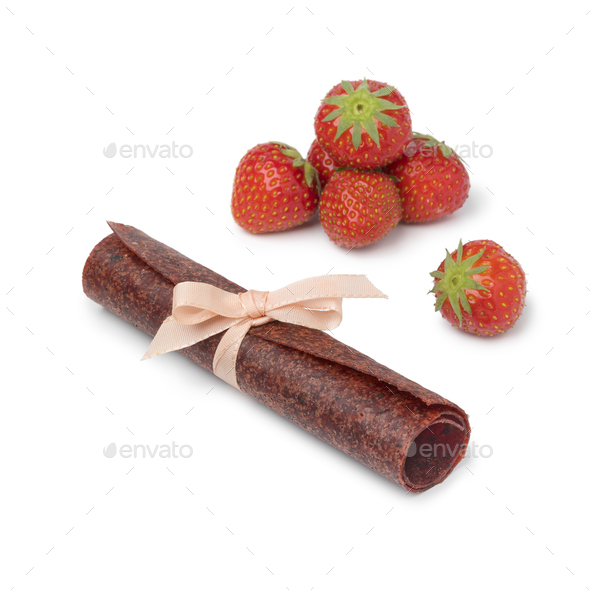 Roll of fruit leather as a naturally sweet snack and fresh straw