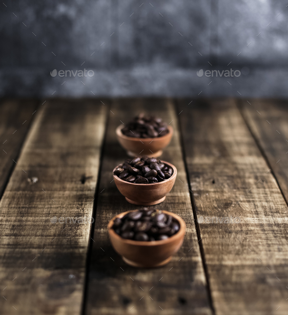 coffee beans with wooden saucer