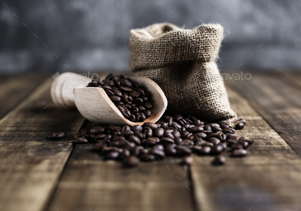 coffee beans with wooden scoop and bag