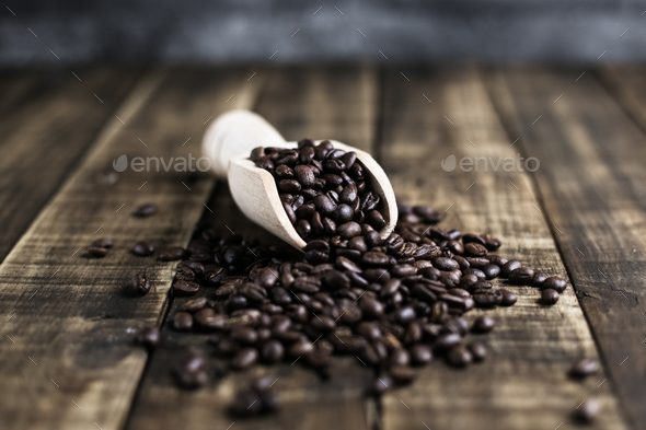 coffee beans with wooden scoop