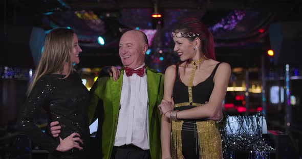 Portrait of Cheerful Senior Caucasian Man in Green Jacket and Red Bow Tie Standing alt