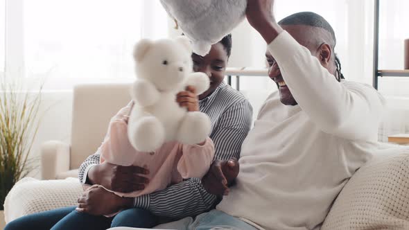Three People Afro American Family Have Fun at Home Sitting on Couch alt