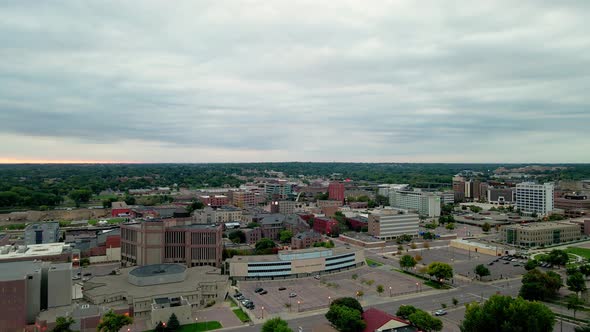 Aerial view of cityscape in Minnesota with cloudy sky. Mix of old and new buildings, large and small