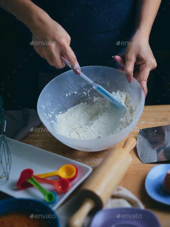 Chef mixes the flour in mixing bowl - Stock Photo - Images