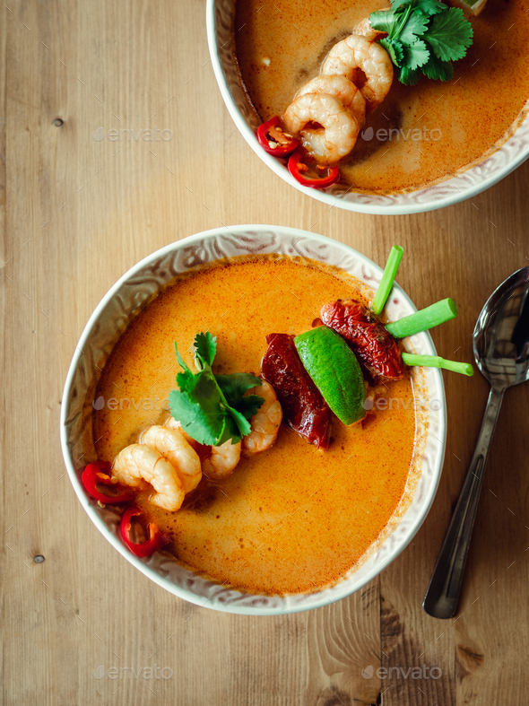 Tom yam kong or Tom yum soup on wooden table - Stock Photo - Images