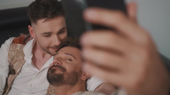Funny Romantic Male Gay Couple Using Smartphone for Video Call alt