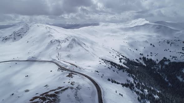 Storm brewing over the peaks on Loveland Pass, Colorado. Aerial views of mountains and highway 6. alt