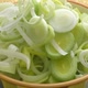 Fresh chopped leek in a ceramic bowl isolated. Sliced leeks - VideoHive Item for Sale