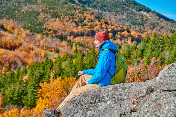 Backpacker man at Artist's Bluff in autumn - Stock Photo - Images