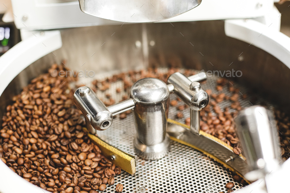 Fresh roasted coffee beans in a modern coffee roasting machine