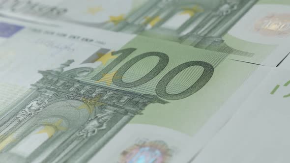 Rows of European Union paper currency in  100 denominations close-up 4K 2160p 30fps UltraHD panning  alt