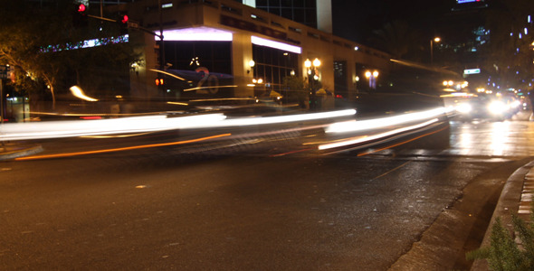 Cars Driving Down City Street At Night Time Lapse 