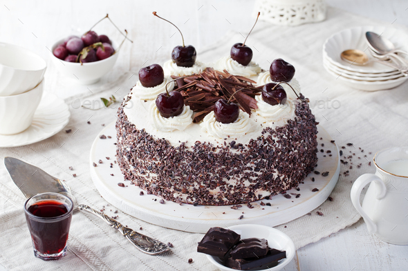 Black Forest Cake, Schwarzwald Pie, Dark Chocolate and Cherry Dessert on a White Wooden Background.