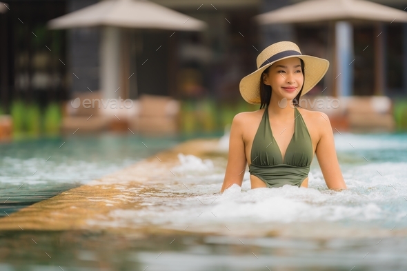 Portrait beautiful young asian woman relax in luxury outdoor swi - Stock Photo - Images